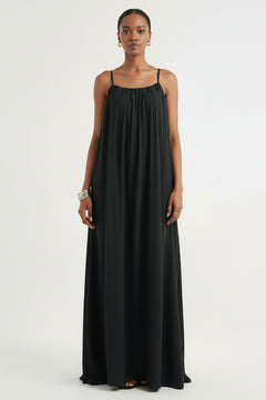 Black spaghetti-strap flowy maxi dress with gathered neckline and vertical pleats
