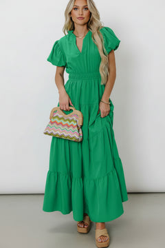 Green tiered maxi dress with puff sleeves and gathered waist, V-neck