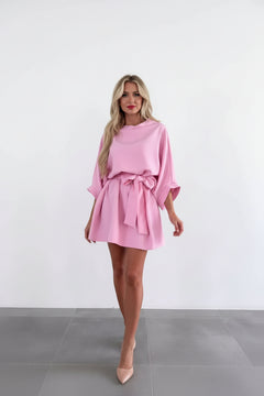 Pink batwing tie-waist mini dress with gathered bow at waist