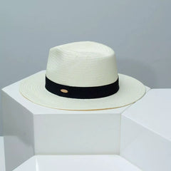 Ivory white straw wide brim hat with black ribbon band and oval buckle