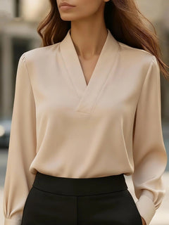 Satin V-neck long-sleeve blouse in beige with gathered puff sleeves and elastic cuffs.