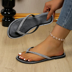 Black rhinestone toe-post sandals with V-strap and textured jeweled border