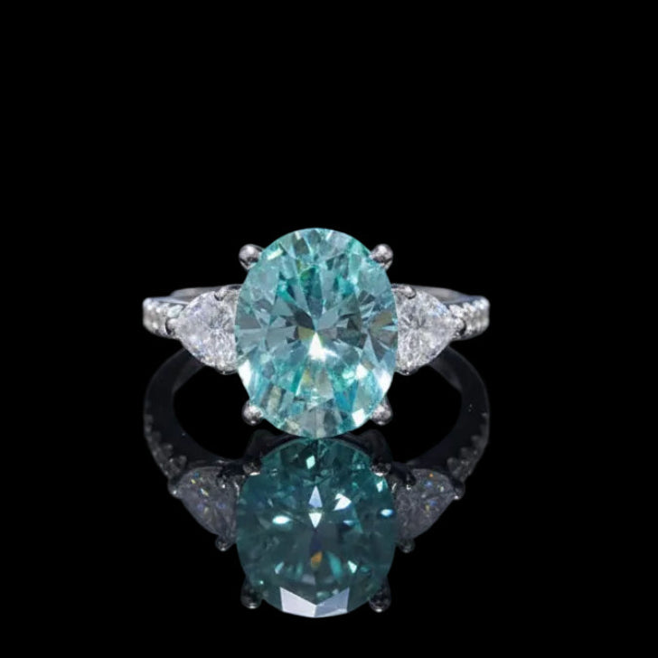 Ring with a large blue gemstone on a black background