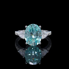 Ring with a large blue gemstone on a black background