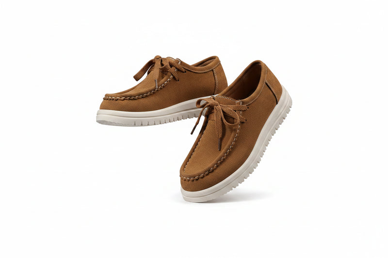 Brown suede lace-up loafers with white rubber sole, flat profile and stitched moc toe
