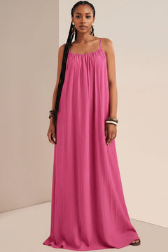 Fuchsia pink spaghetti-strap maxi dress with gathered neckline and flowing pleats