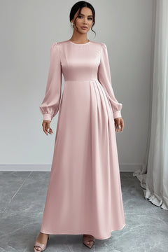 Blush pink satin long sleeve maxi dress with crew neck and draped pleats at skirt