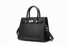 Black crocodile-embossed leather top handle handbag with gold clasp and strap
