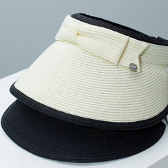 Ivory straw sun visor hat with black trim and bowknot detail