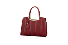 Red leather top-handle handbag with gold frame handle and front leather charm