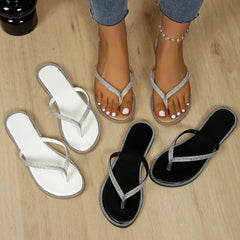 Assorted rhinestone toe-post sandals in white and black with jeweled edging