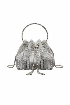 Silver rhinestone bucket crossbody bag with top handle and tassel pull closure.