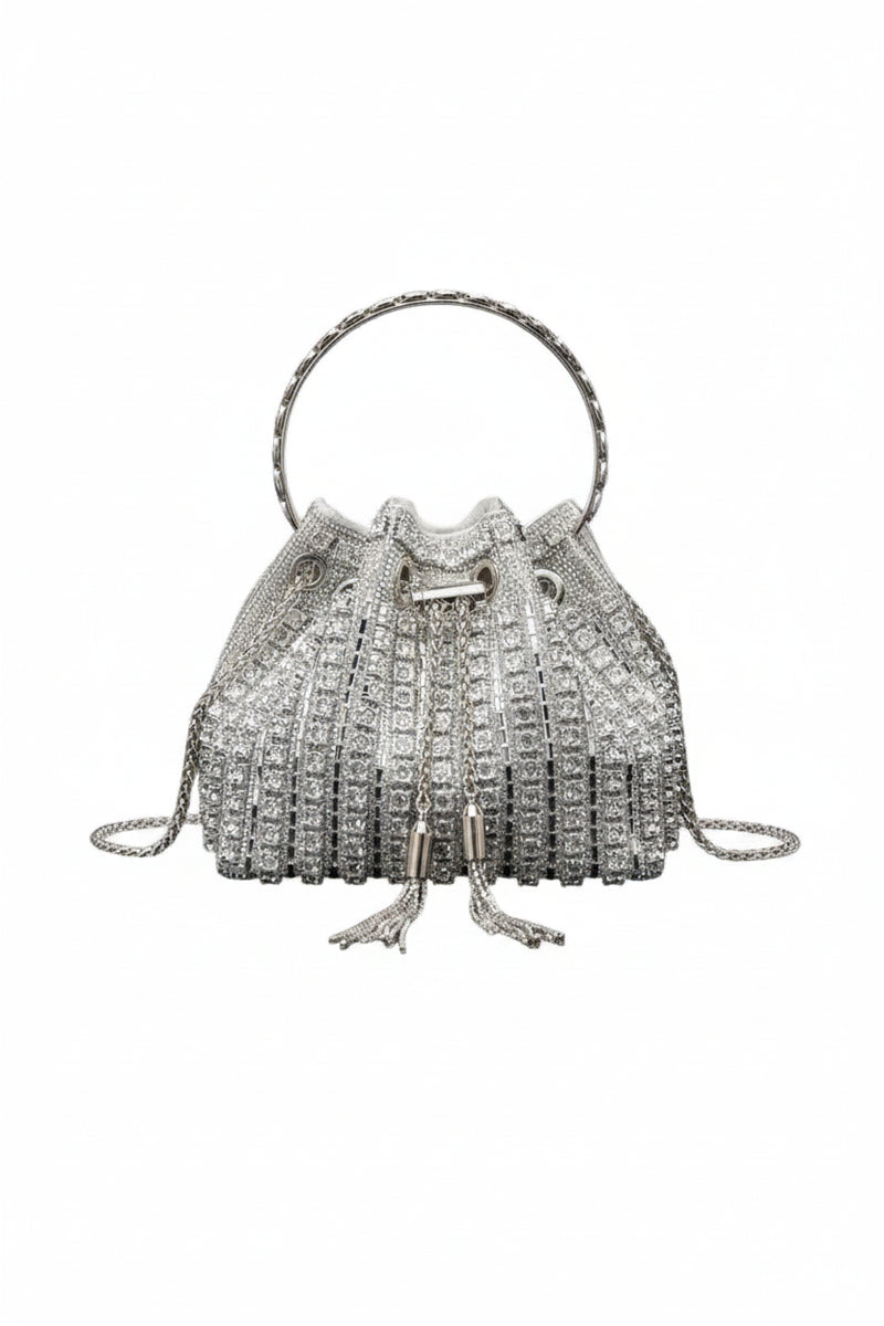 Silver rhinestone bucket crossbody bag with top handle and tassel pull closure.