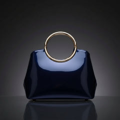 Indigo glossy ring-handle handbag with structured body and gold-toned handle