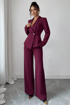 Burgundy one-button blazer and wide-leg pants set, fitted blazer and flared legs.