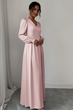 Blush pink satin long sleeve maxi dress with crew neck, ruched cuffs, gathered waist