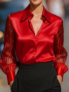 Red collared blouse with button-front V-neck and sheer striped sleeves