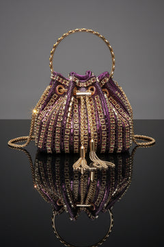 Rhinestone bucket crossbody bag in purple with gold-toned trim and chain straps