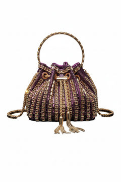 Purple rhinestone bucket crossbody bag with top handle and tassel drawstring closure.