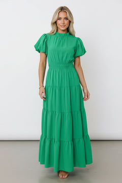 Green tiered maxi dress with gathered waist and short puff sleeves