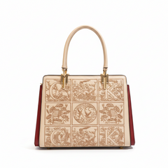 Apricot leather top-handle handbag with embossed patterned front and gold-tone hardware